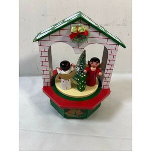H.H 7"' tall Christmas musical figurine (works sometimes) missing 1 present Taiw